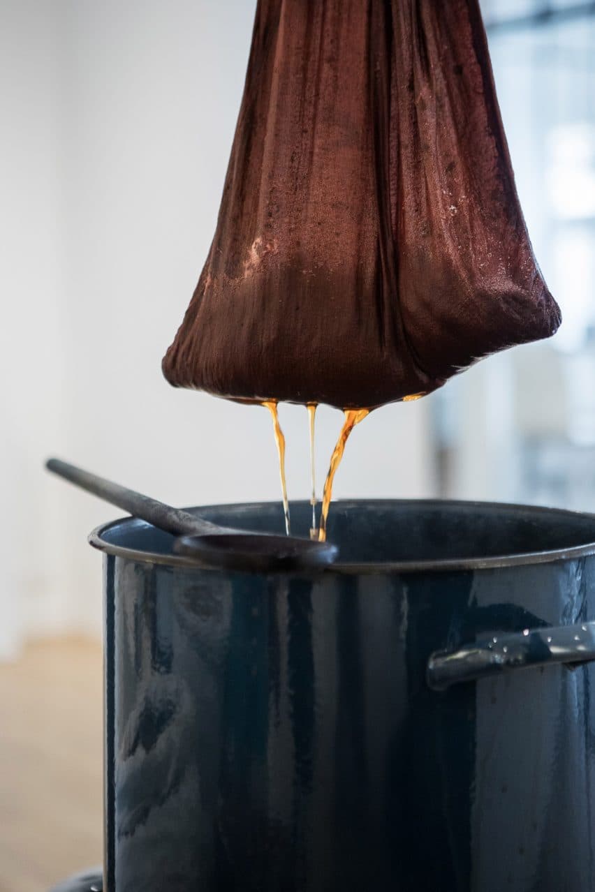Wool being dyed in a pot
