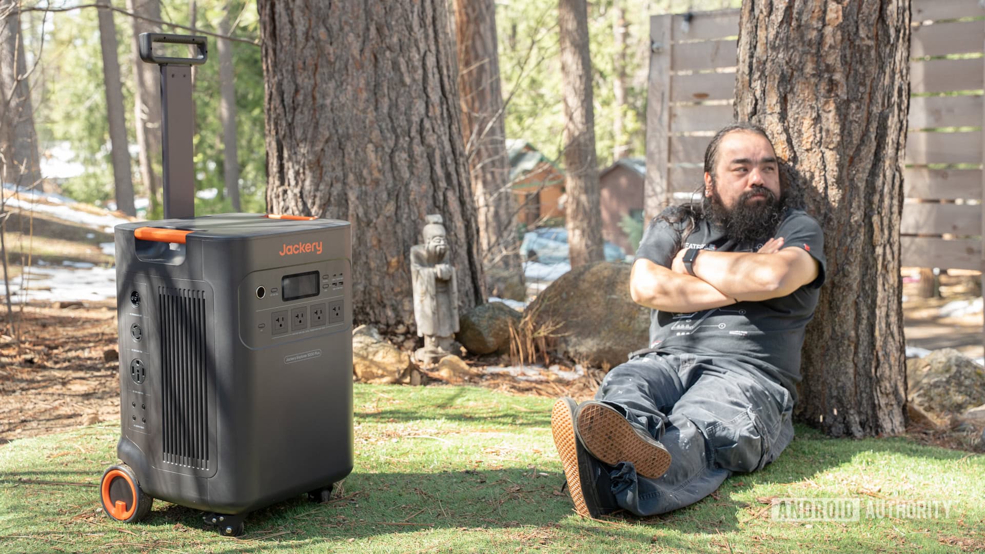 Edgar sitting next to Jackery Explorer 5000 Plus power station